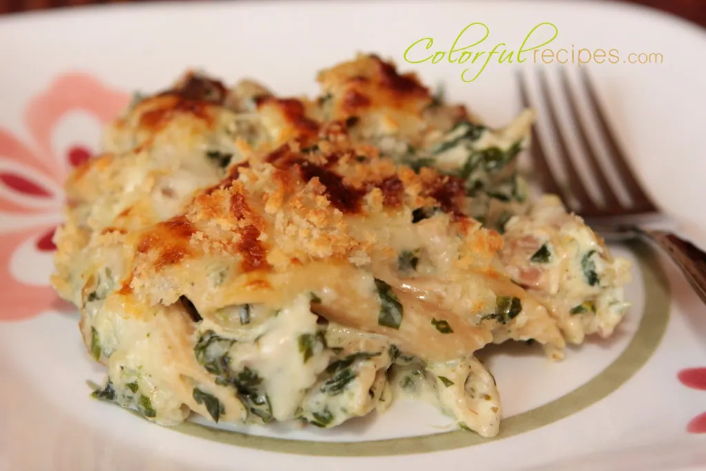 Serving of creamy spinach chicken penne bake with a golden panko topping