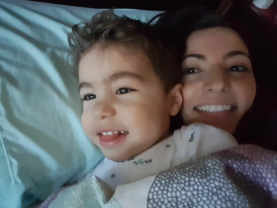 Christine snuggling with her son Roy and his fluffy cheeks