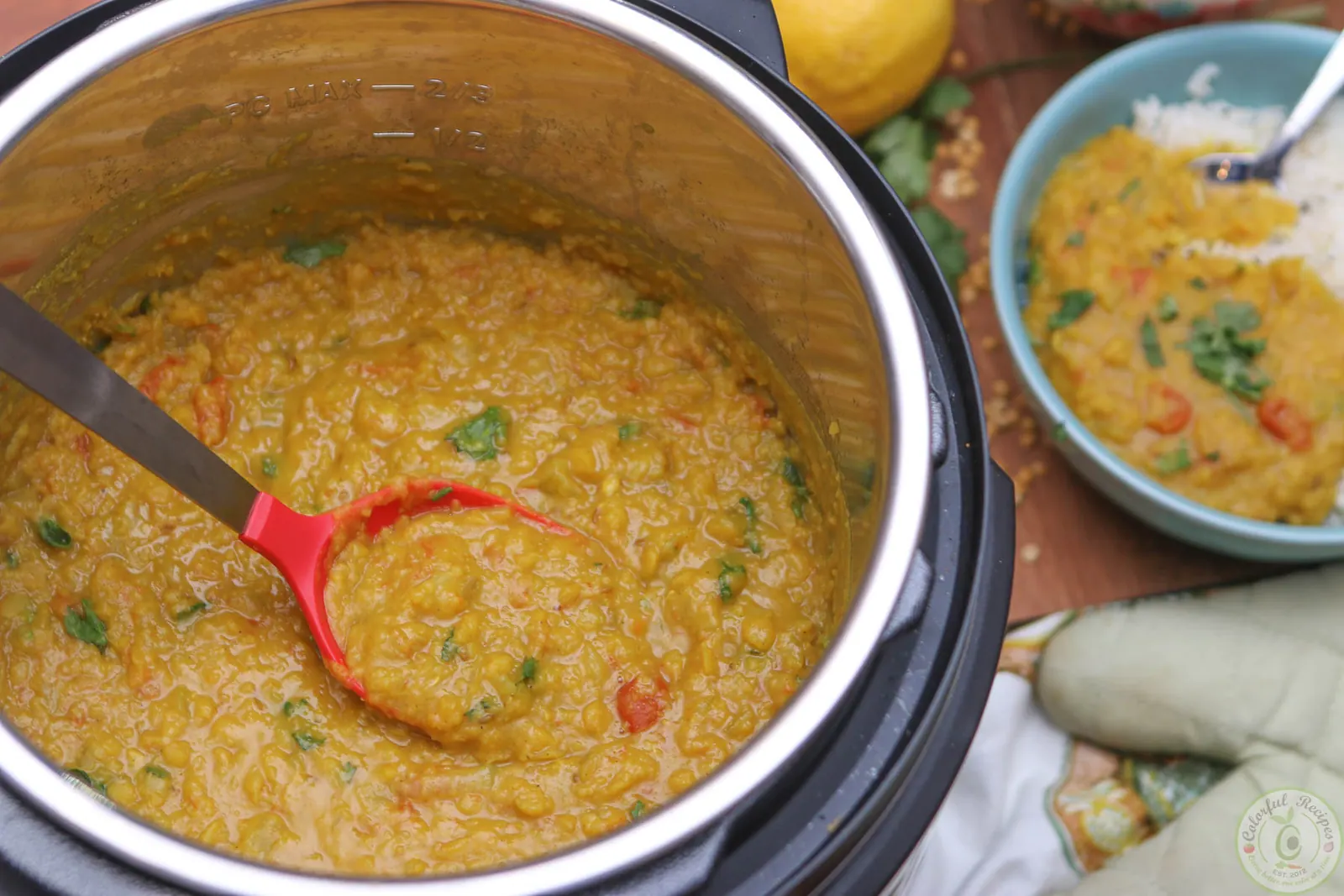 Bowl of buttery Instant Pot pigeon pea dal served over rice