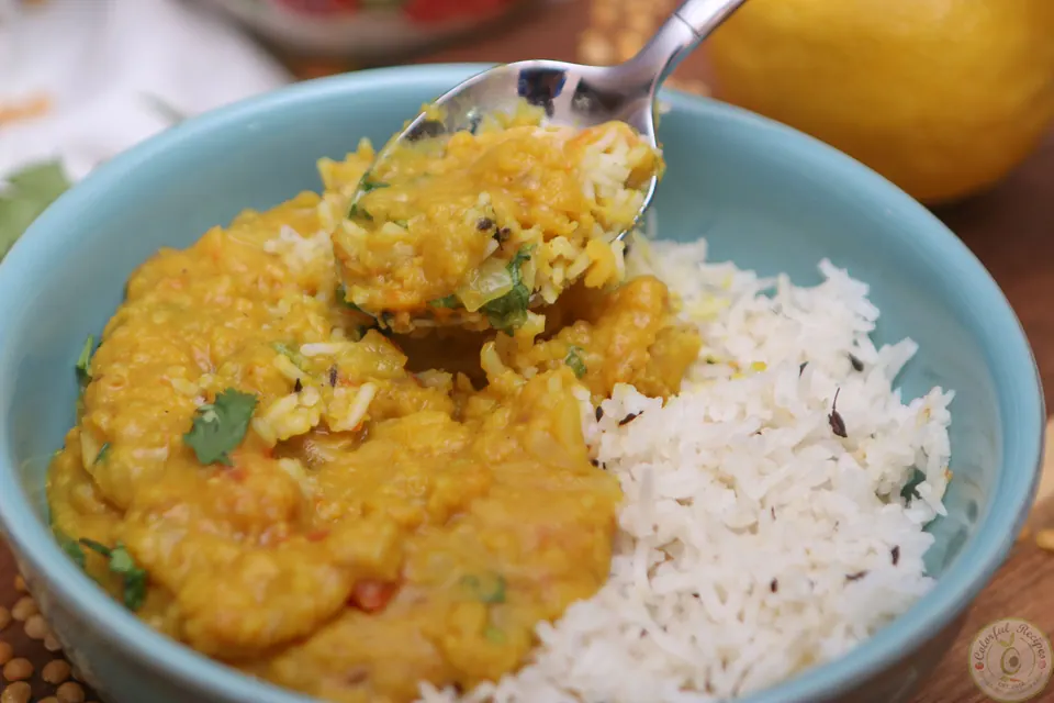 Pigeon pea dal and rice garnished with fresh cilantro